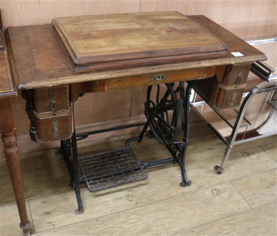 An Excelsior sewing machine within table W.95cm